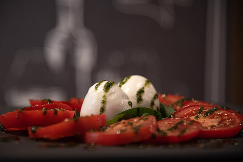 Fresh caprese salad with mozzarella and tomatoes